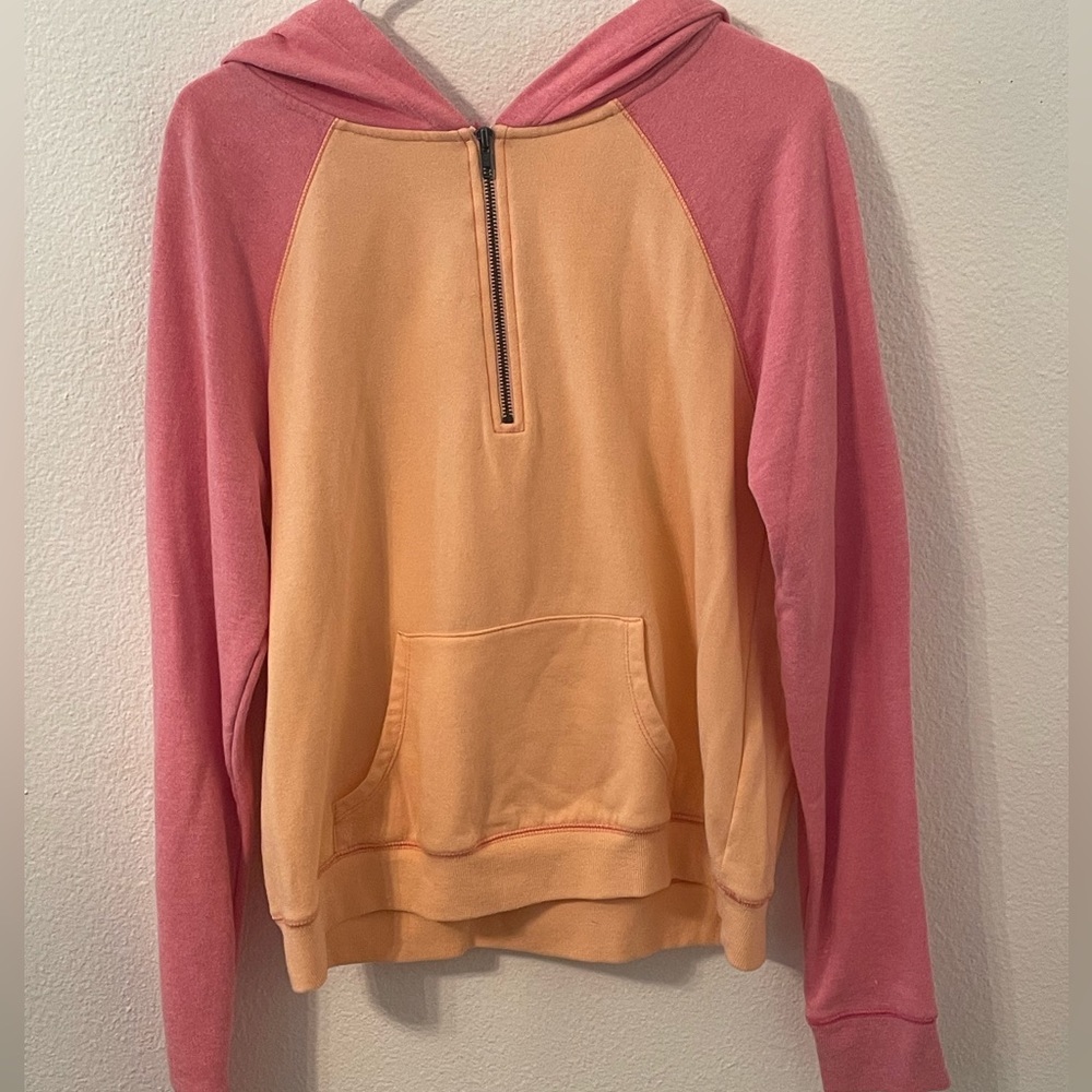 This is a pink and orange hoodie